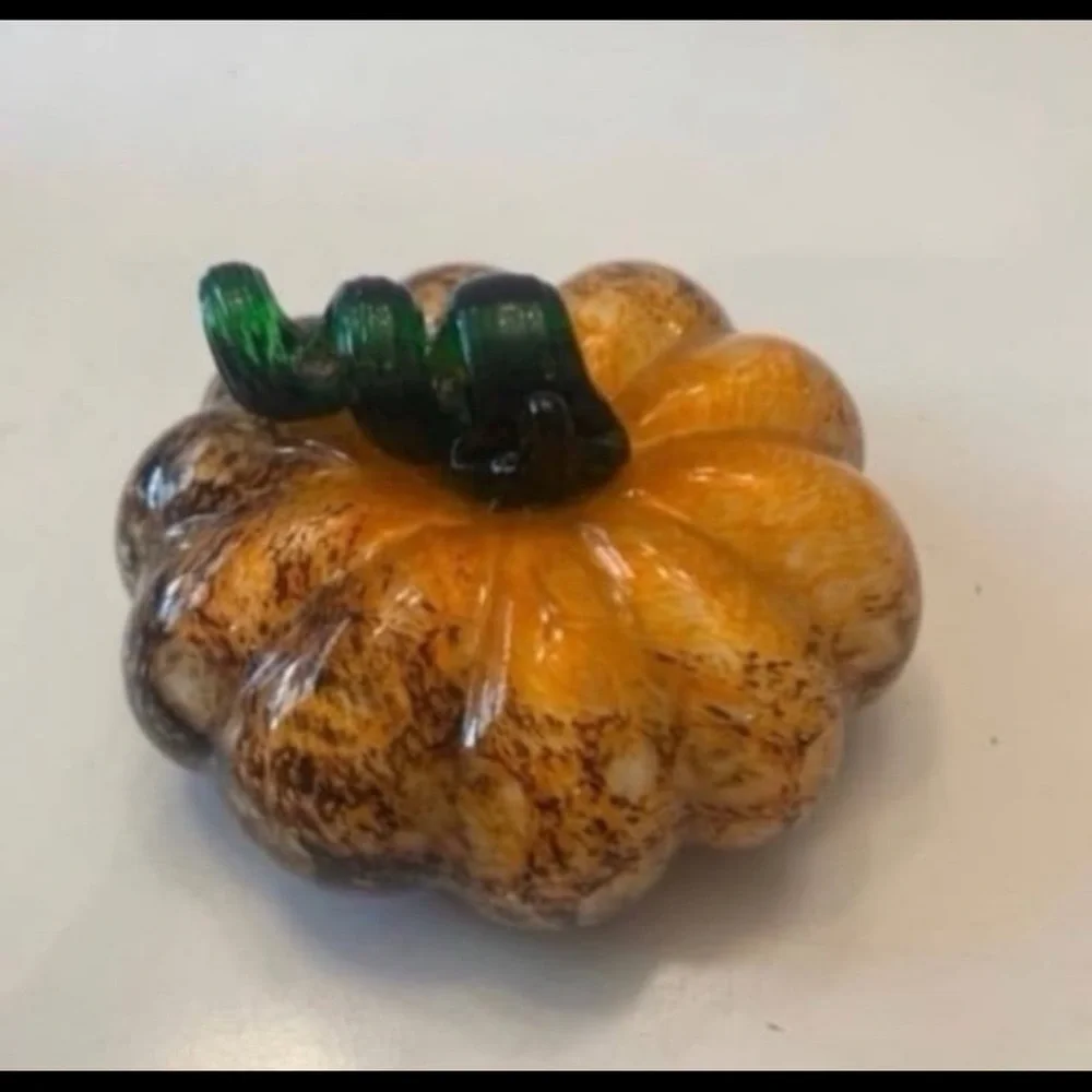 Orange and brown glass pumpkin with green stem